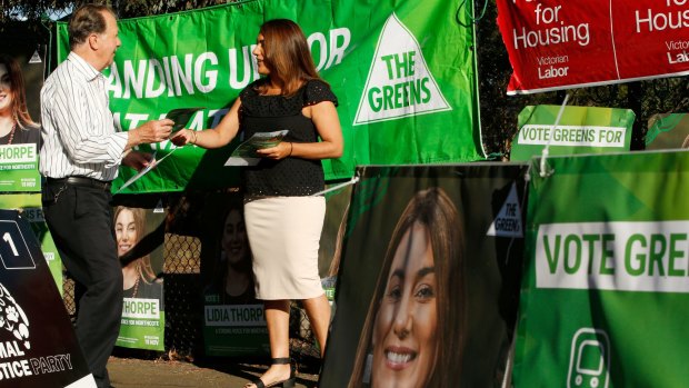 How do you deal with a problem like the Greens? Greens candidate in the Northcote byelection Lidia Thorpe hands out how to vote cards at Thornbury Primary School.