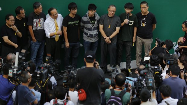 Members of the student movement speak to the media in Hong Kong. 