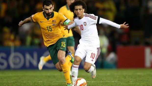 Zero-sum game: Mile Jedinak competes against UAE's Omar Abdulrahman. Australia's success in qualifying for World Cups is seen as taking away a spot from the rest of the Confederation.