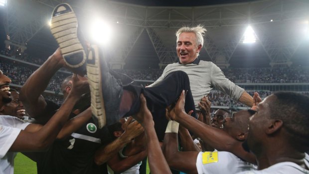 Bert van Marwijk is thrown into the air by the Saudi players after leading them to the World Cup. His contract was not renewed for the tournament.