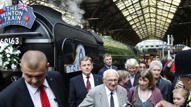 Nicholas Winton, centre, who organised the Winton Train rescue of Jewish children from Czechoslovakia prior to WWII, visits Liverpool Street Station in London in 2004.