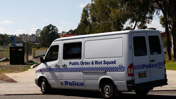 A public order and riot squad van arrives at Villawood Detention Centre on Thursday.