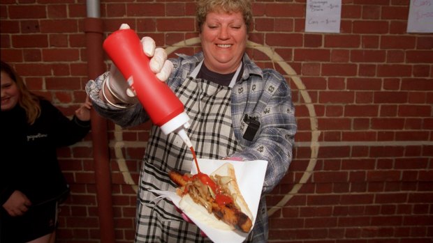 Lois Beggs runs the sausage sizzle at the polling booth at the Brunswick South West Primary School.