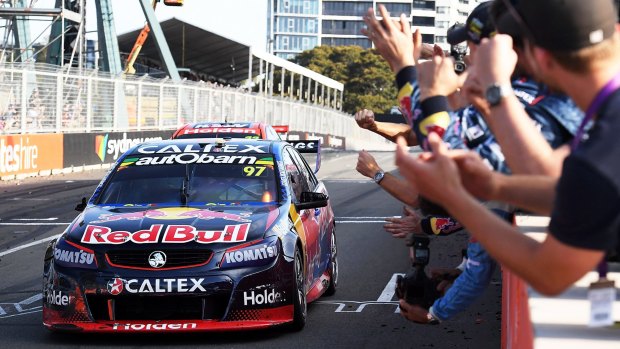 Shane Van Gisbergen crosses the finish line to finish in third place to win the Supercars title