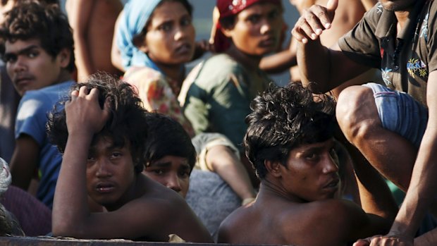 Stranded and desperate: Migrants are seen aboard a boat tethered to a Thai navy vessel in waters near Koh Lipe island, Thailand.