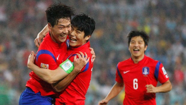 Final-bound: Kim Young Gwon celebrates with Ki Sung Yueng.