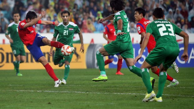 Decisive: South Korea's Kim Young Gwon scores his country's second goal against Iraq. 