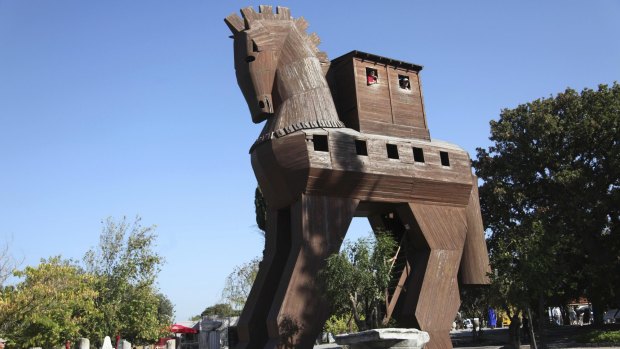 Tourist clicking photographs of a Trojan Horse replica in Troy, Turkey.