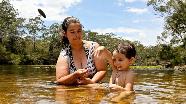 Hayley Brown, with her nephew Kaius, sought some relief from Tuesday's heat at Parramatta Lake.