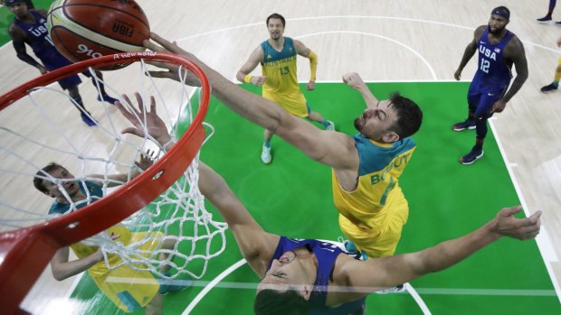 Defensive presence: Australia's Andrew Bogut tries to block a shot by his former Golden State teammate, United States guard Klay Thompson.