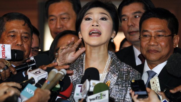 Yingluck Shinawatra arrives at Thai parliament before the debate on her impeachment.