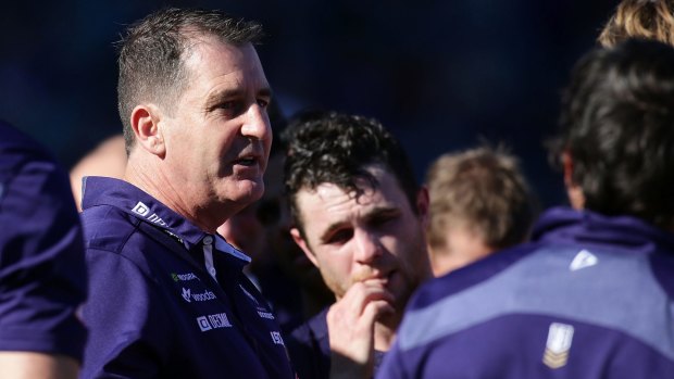 Make or break: Dockers coach addresses his players at quarter time.