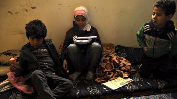 Children who fled Yarmouk inside a makeshift classroom in Yalda.