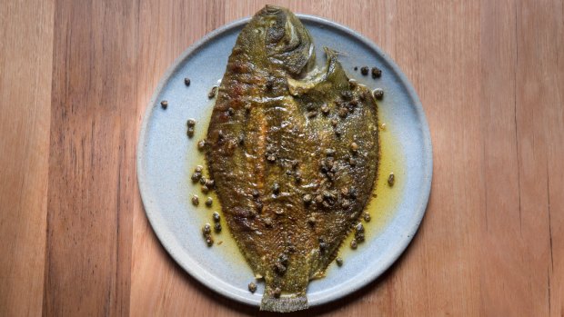 The flounder is sluiced in simple brown butter with lemon and capers.