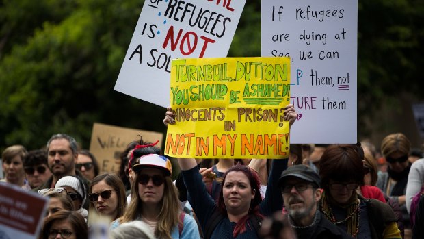 Protesters are seen at the march for refugees in Melbourne CBD.