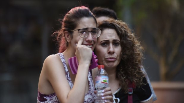 People flee from the scene after the van attack in the historic Las Ramblas district of Barcelona, Spain.