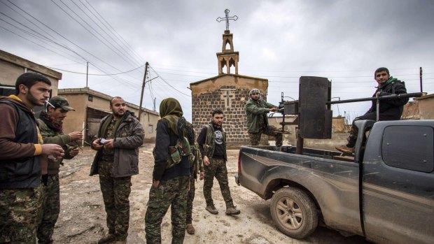 Fighters of the Kurdish People's Protection Units (YPG) in the Assyrian Christian town of Tel Jumaa.