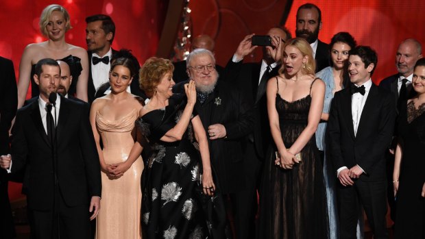 The cast and crew from <i>Game of Thrones</i> accept the award for outstanding drama series at the Emmy Awards in September.