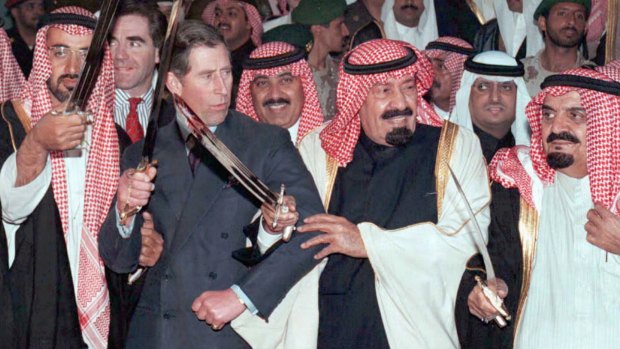 Prince Charles performs a traditional sword dance with then crown prince and later king Abdullah in Saudi Arabia in 1997.
