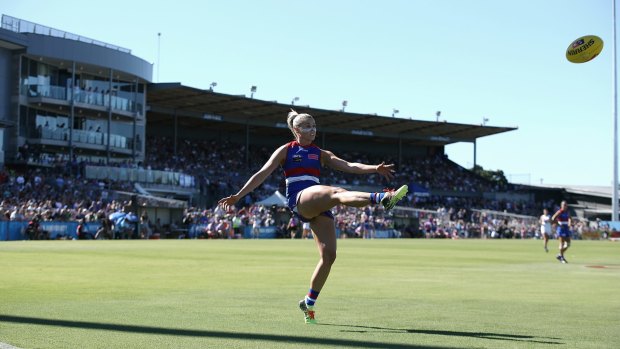 Top Dog: Captain Katie Brennan kicks her second goal for the Bulldogs from the boundary line in the first term.