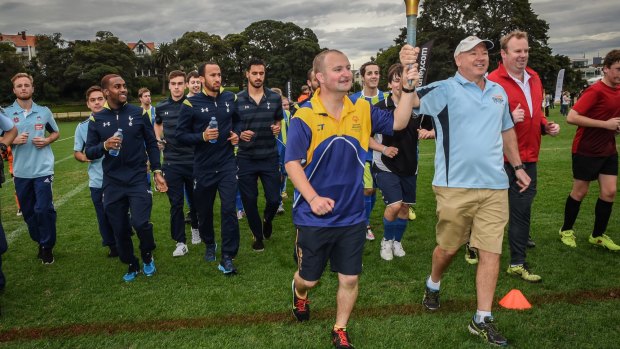 Putting something back: Spurs and Sydney FC players conducted a coaching clinic for members of the Special Olympics football team at Birchgrove Oval on Friday.