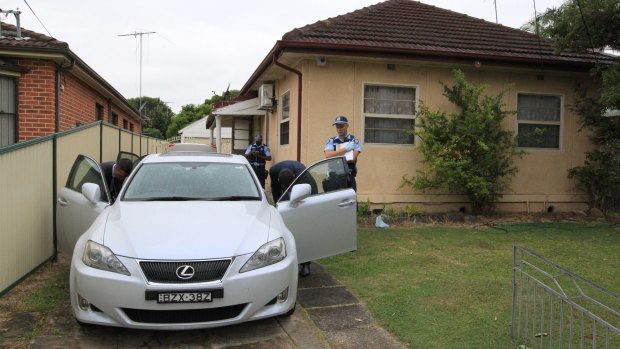 Police search Khanh Thanh Ly's house and two cars in Sydney's inner west.