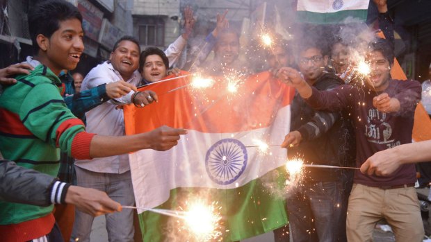 Indian fans celebrate in Amritsar after India won their 2015 Cricket World Cup cricket match against Pakistan.