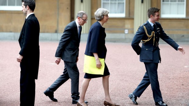 Theresa May arrives with her husband Philip May at Buckingham Palace.