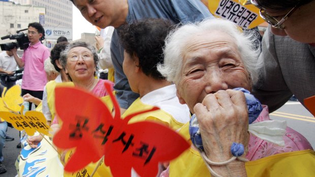 A former South Korean 'comfort woman' Lee Sun-duk, right,  and others who suffered indignities in WWII,  at a protest in Seoul in 2007.