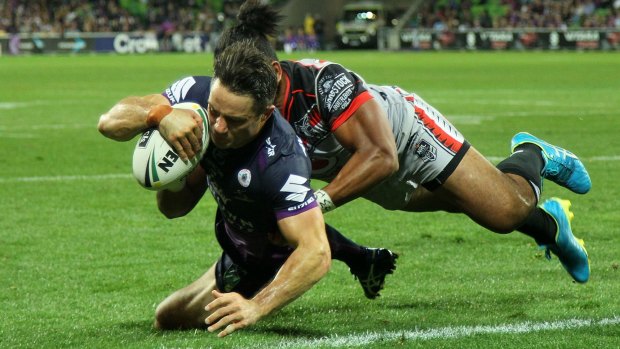 Cooper Cronk of the Storm about to touch down against the Warriors.