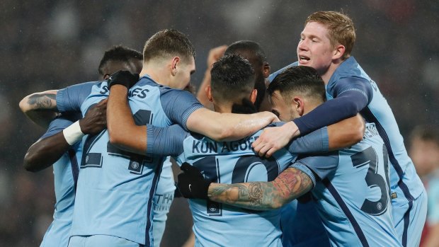 Five star: Manchester City celebrate another goal against West Ham in the FA Cup.