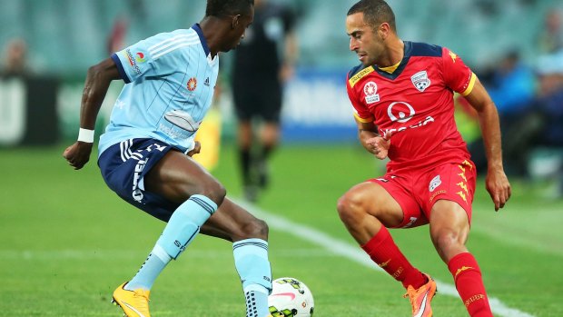 New Socceroo: Tarek Elrich competes for possession with Sydney FC's Bernie Ibini.
