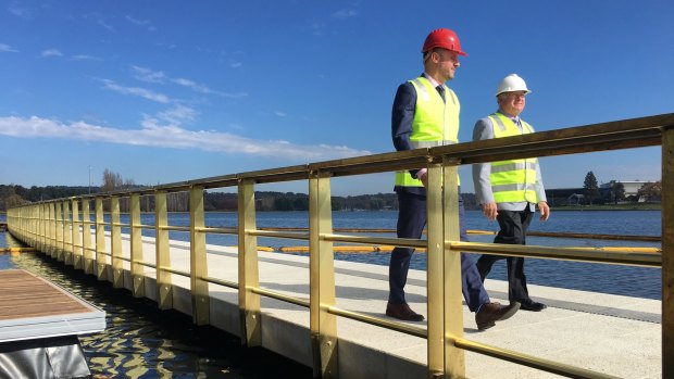 Andrew Barr and Mick Gentleman check out the first part of the West Basin boardwalk on Tuesday.