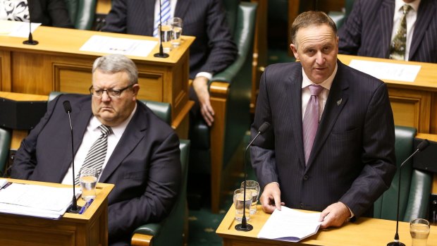John Key delivers a ministerial statement regarding New Zealand's contribution to the coalition against ISIL while Defence Minister Gerry Brownlee looks on.