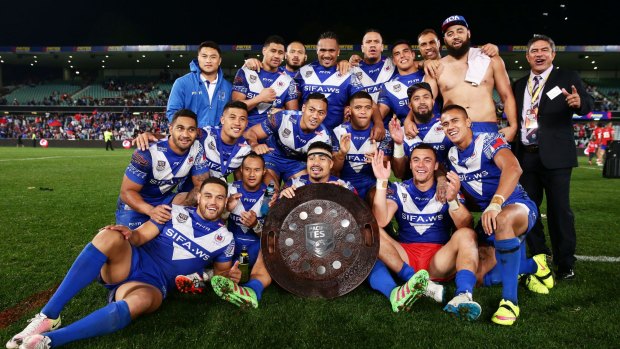 Pride: Samoa celebrate with the Pacific Test trophy after their hard-fought victory over Tonga.
