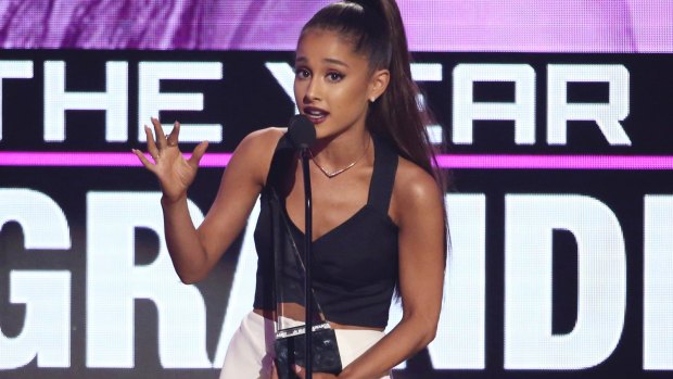 Ariana Grande accepts the award for artist of the year at the American Music Awards on Sunday, Nov. 20, 2016.