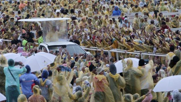 More than 150,000 braved the catergory-one storm in Tacloban to see the Pope.