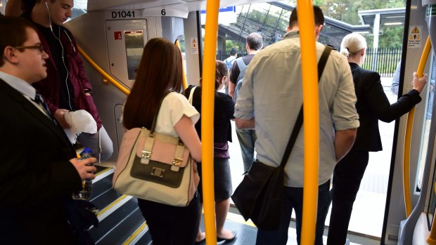 Commuters change trains at Glenfield on the new South West Rail Link on Friday. 