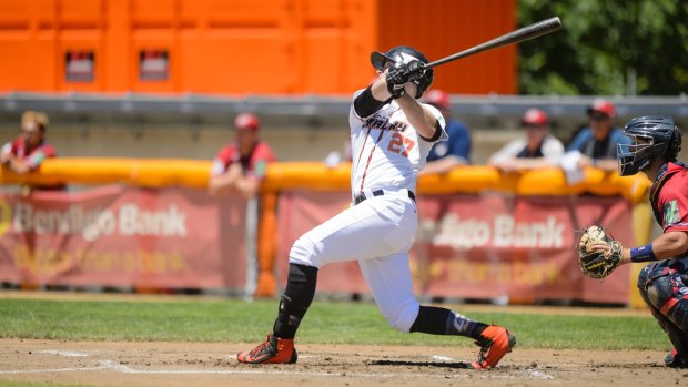Canberra outfielder David Kandilas hits a two-run homer off Melbourne starter Jon Kennedy in the first inning. 