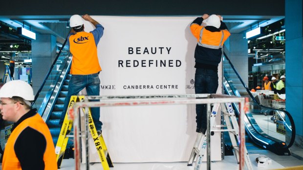 Workers preparing for the opening of the Canberra Centre's Monaro Mall beauty shopping area on Thursday.