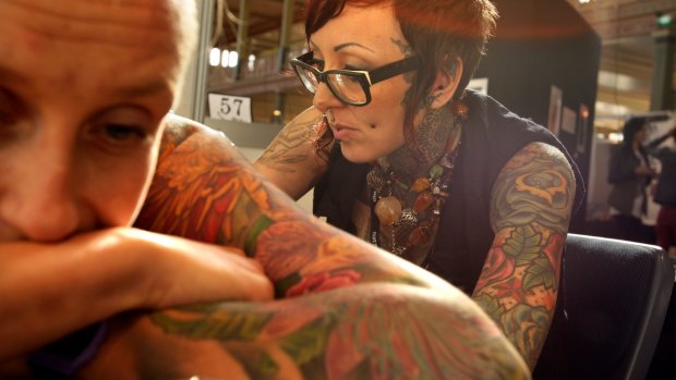 Not-so-secret ink: British spy agency MI5 has joined other employers, including some Australian police forces, in avoiding recruits with visible tattoos.