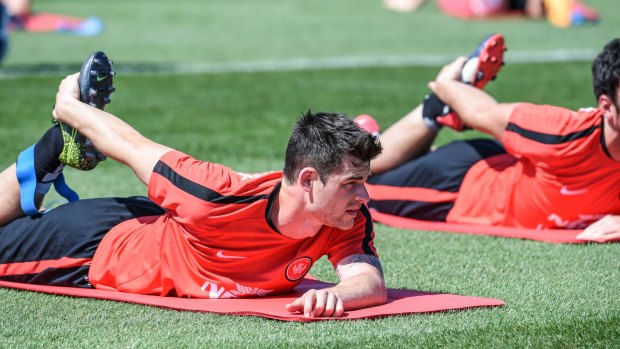 At a stretch: Brendan Hamill prepares for the Sydney Derby against Sydney FC this weekend.
