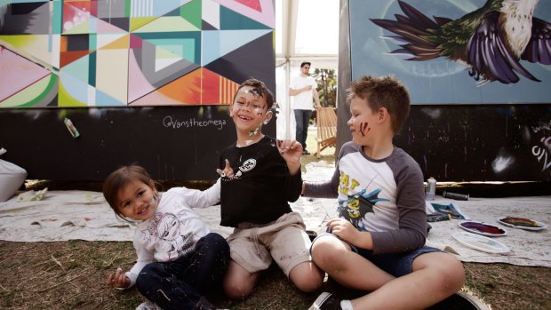 Pint-sized painters: Ruby Rehu, 3, Kaelan Russell, 6, and Isaiah Marinos, 6, at a Darling Harbour outdoor exhibition space.