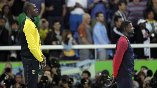 A clear victor: Jamaica's gold medallist Usain Bolt and American silver medal winner Justin Gatlin listen to the Jamaican anthem during the medal ceremony for the men's 100-metres final at the Olympic stadium in Rio.