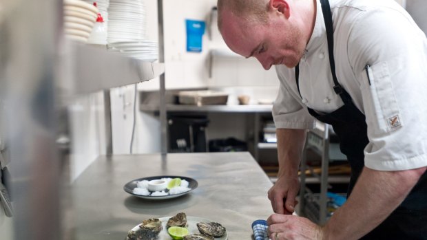 Awe shucks: Temporada chef Chris Darragh prepping the beautiful oysters.