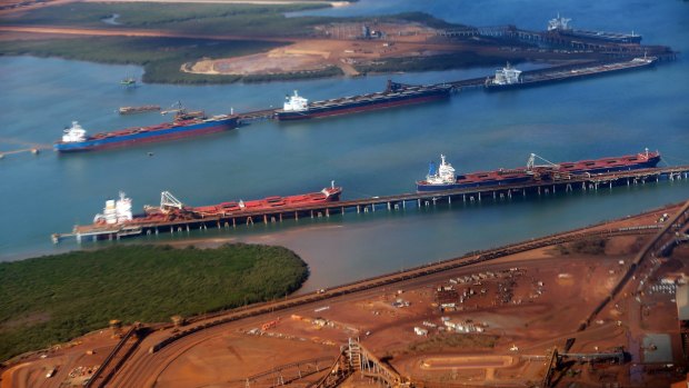 Bulk carriers are loaded with iron ore off Port Hedland. 
