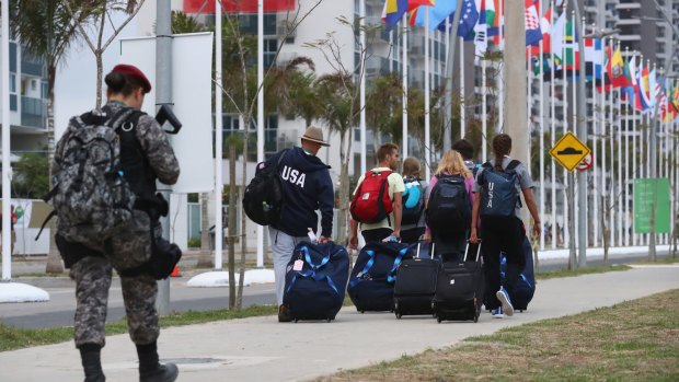 A security officer patrols as athletes arrive at the Olympic Village ahead of the Rio 2016 Olympic Games.