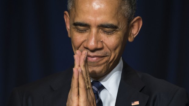 US President Barack Obama bows his head towards the Dalai Lama.