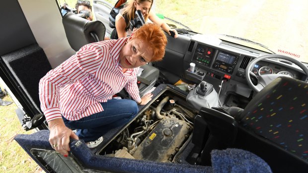 One Nation leader Pauline Hanson inspects the engine bay of the Battler Bus on Thursday.