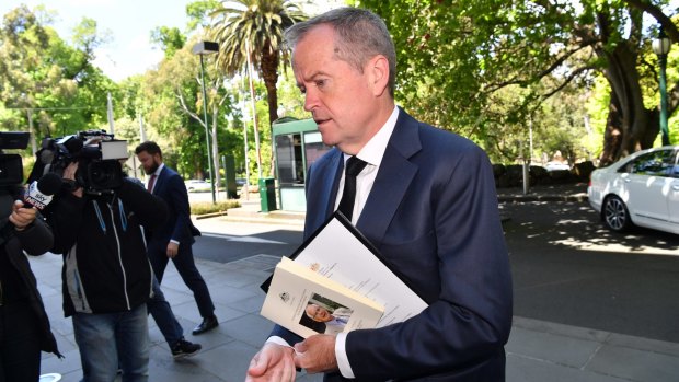 Opposition Leader Bill Shorten arrives for the meeting with Prime Minister Malcolm Turnbull.